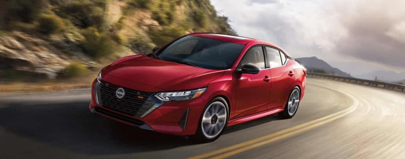 A red 2026 Nissan Sentra from the front.