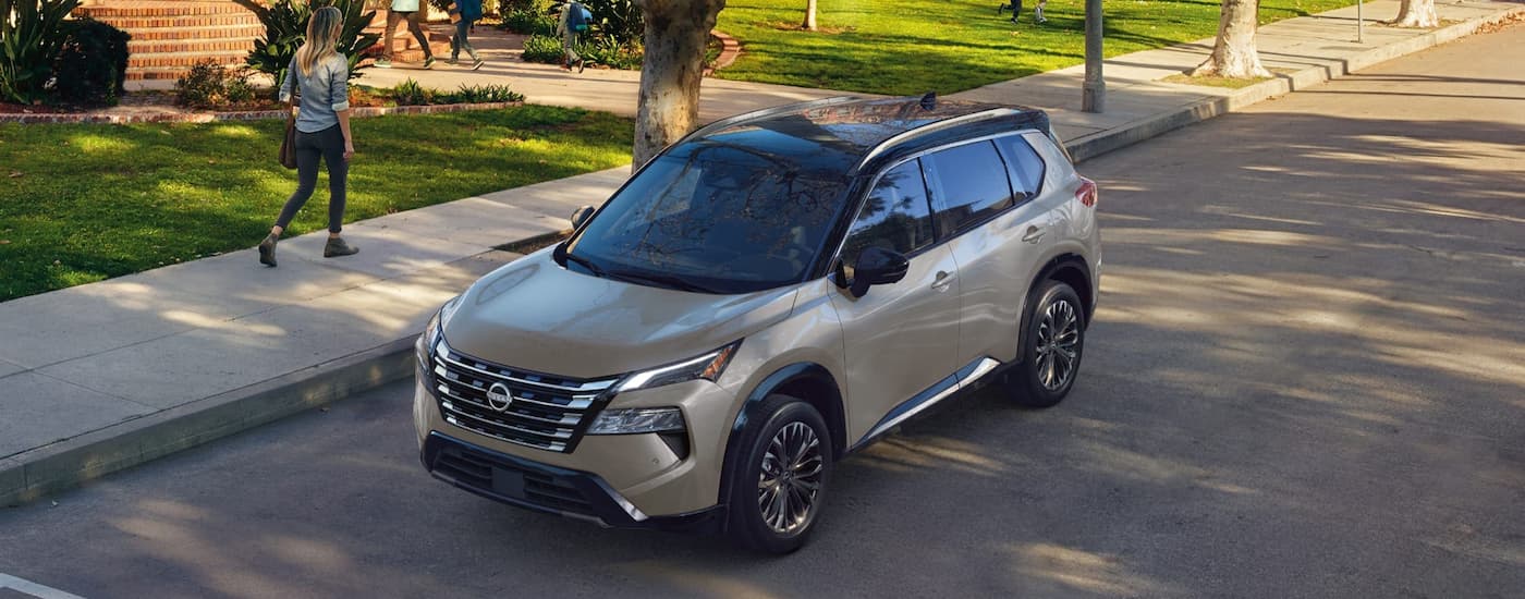Grey 2026 Nissan Rogue parked on the side of a street