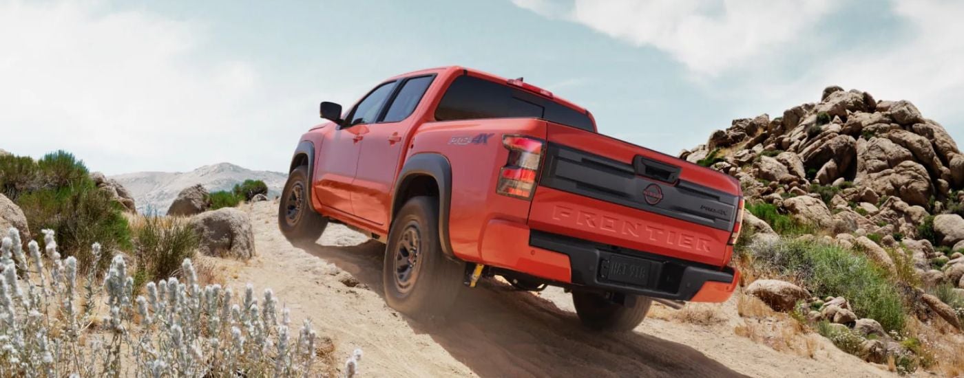 Rear view of a red 2026 Nissan Frontier.
