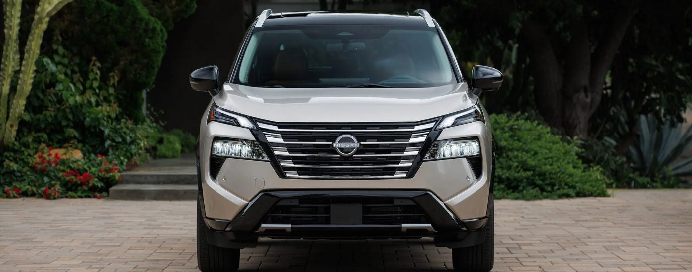 Tan 2026 Nissan Rogue front view.